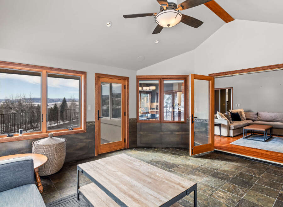 This stunning property boasts a bright and airy sunroom, perfect for enjoying scenic views.