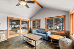 This stunning sunroom offers a serene retreat with its natural light and inviting ambiance.