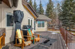 Enjoy outdoor living at its finest with this stunning property featuring a spacious deck, perfect for entertaining or relaxing.