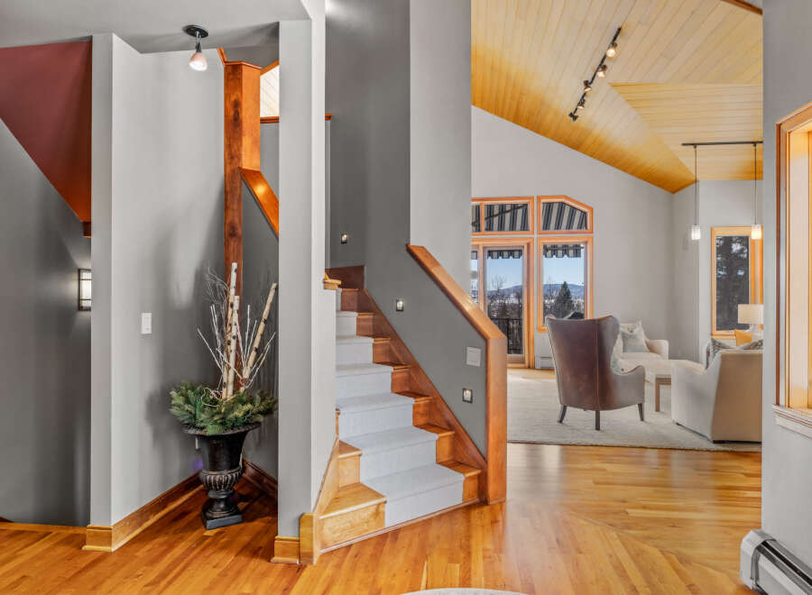 Step into luxury with this stunning property featuring a grand staircase and exquisite hardwood floors.