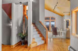 Step into luxury with this stunning property featuring a grand staircase and exquisite hardwood floors.