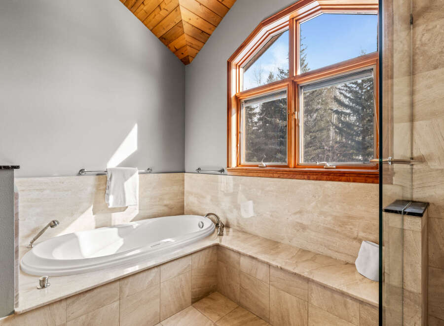 Indulge in luxury within this stunning bathroom, featuring a sleek, modern design.
