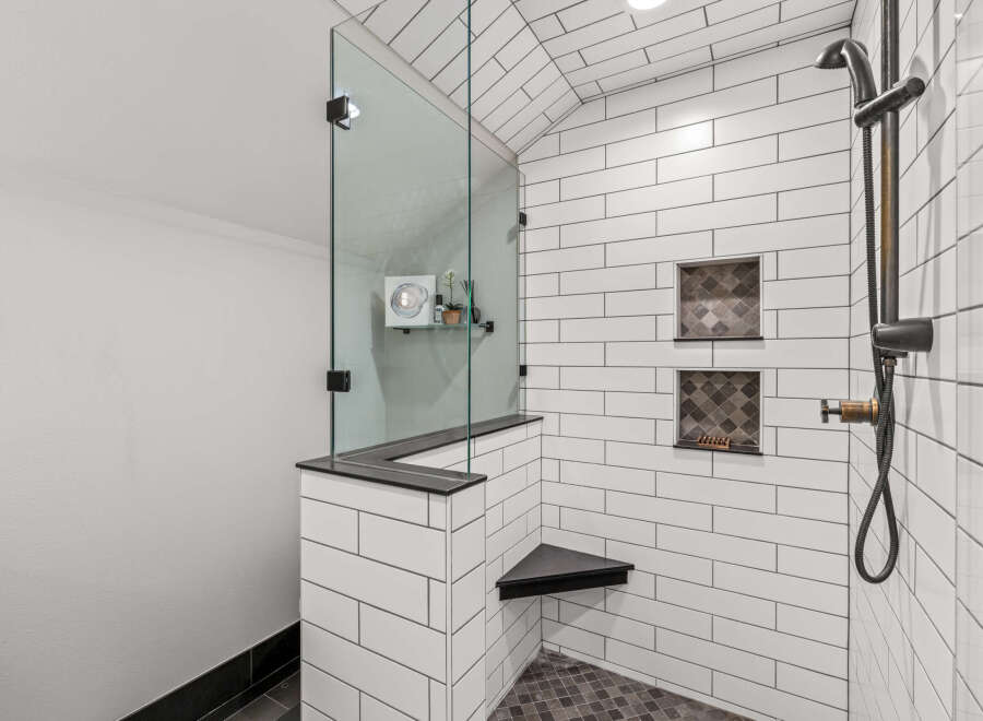 Step into luxury with this stunning bathroom featuring a modern glass shower enclosure.
