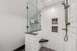 Step into luxury with this stunning bathroom featuring a modern glass shower enclosure.