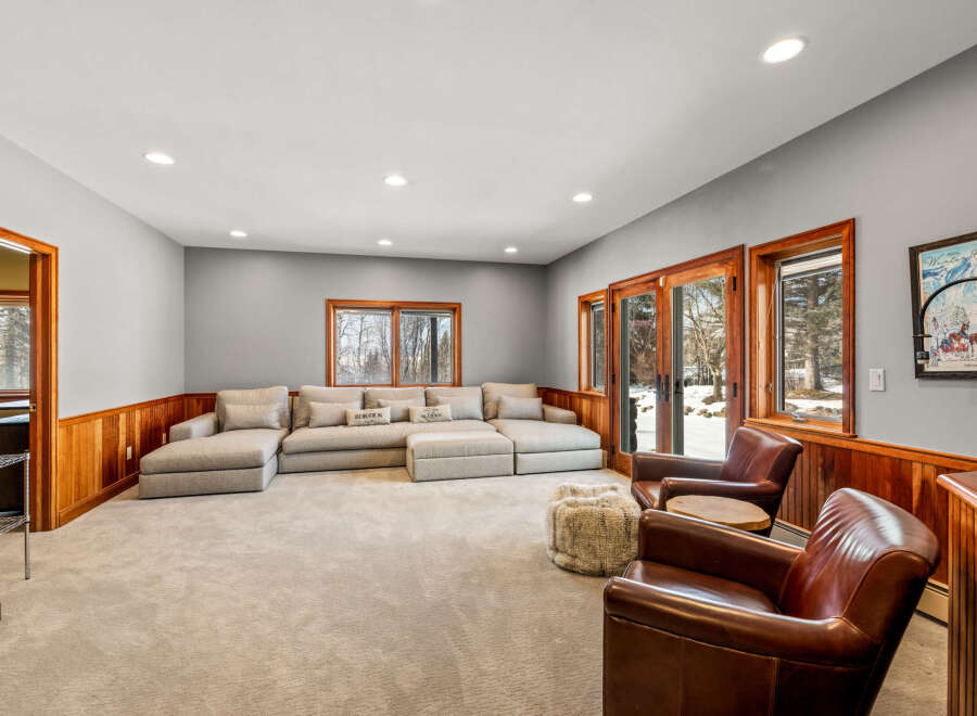 This stunning living room boasts a spacious layout, perfect for entertaining or relaxing.