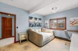 This stunning bedroom boasts a modern design with a touch of elegance.
