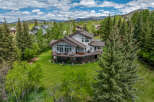 Experience luxury mountain living in this stunning home, nestled amidst lush greenery and mature trees.
