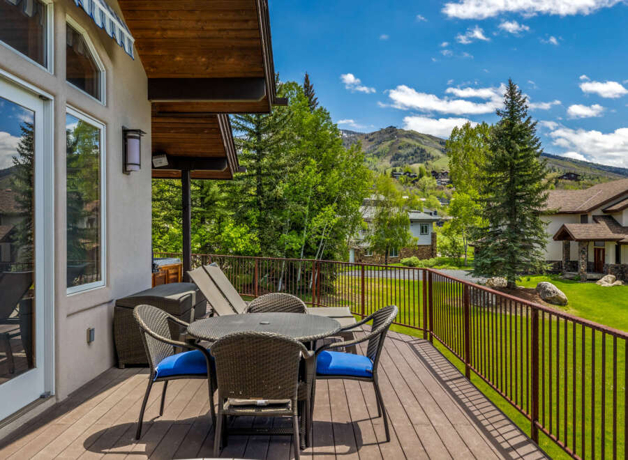 Enjoy breathtaking mountain views from this spacious deck, perfect for outdoor dining and relaxation.