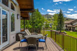 Enjoy breathtaking mountain views from this spacious deck, perfect for outdoor dining and relaxation.