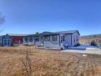 Discover this charming property featuring a cozy home and a spacious lot.