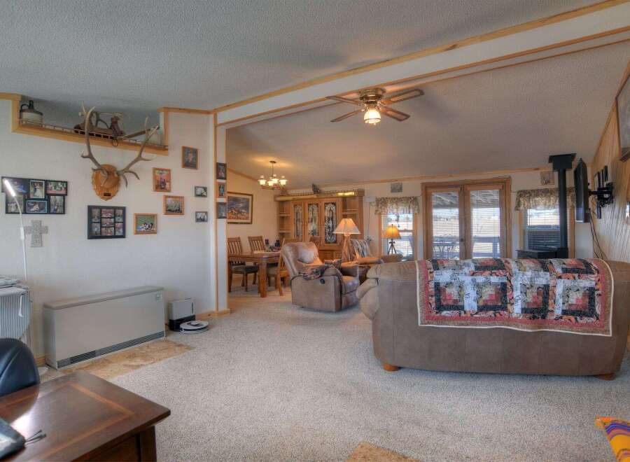 Step into this inviting living space, perfect for relaxation and entertaining.