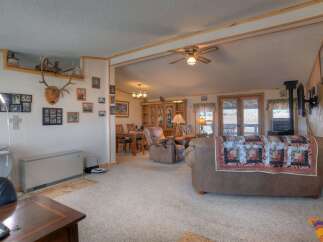 Step into this inviting living space, perfect for relaxation and entertaining.