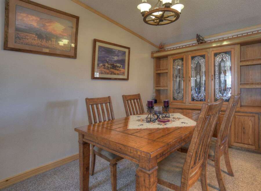 Step into this inviting dining room, perfect for family gatherings and entertaining guests.