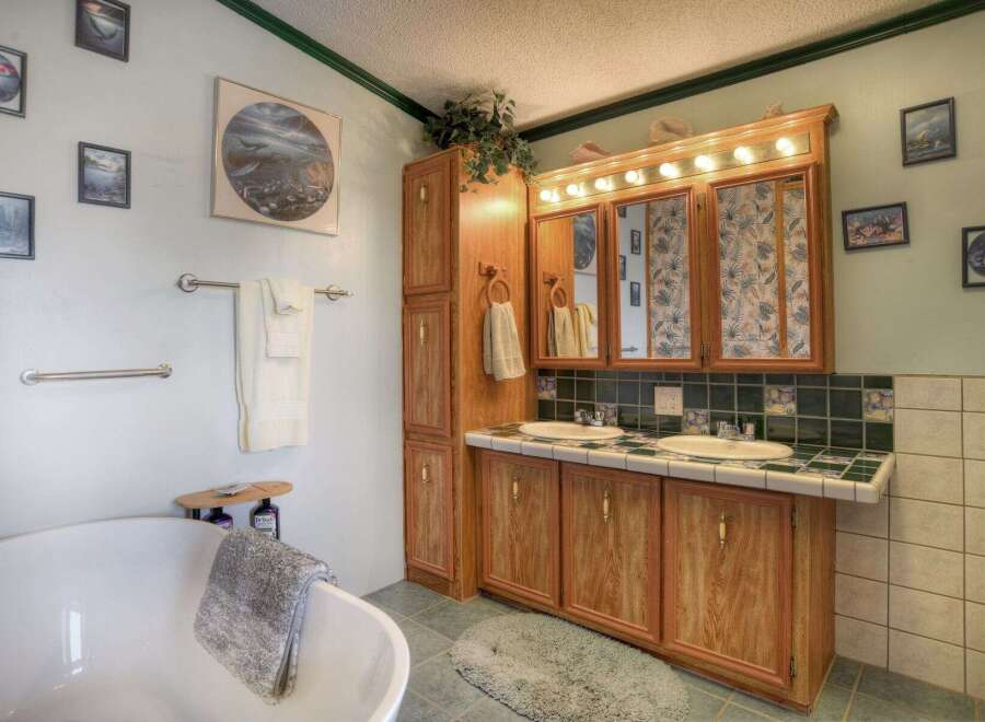 This charming bathroom features a classic design with a touch of elegance.