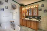 This charming bathroom features a classic design with a touch of elegance.