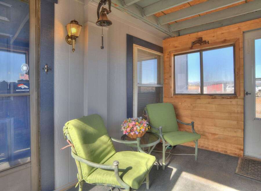 Step into the charm of this inviting porch, perfect for enjoying the outdoors.
