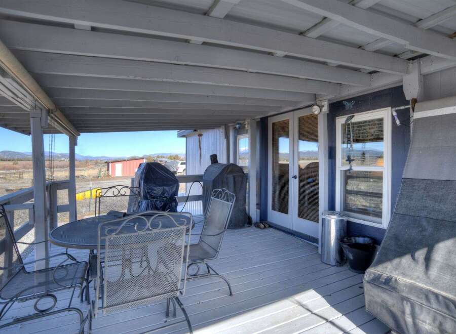 Enjoy the outdoors in style with this charming property featuring a covered patio.