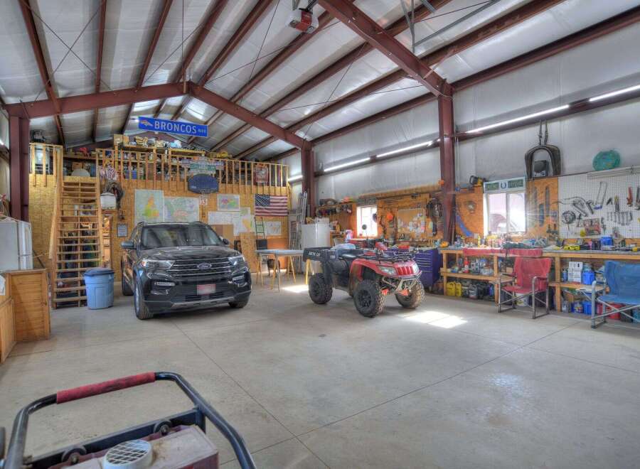 This spacious garage offers ample room for vehicles, equipment, and hobbies.