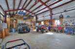 This spacious garage offers ample room for vehicles, equipment, and hobbies.