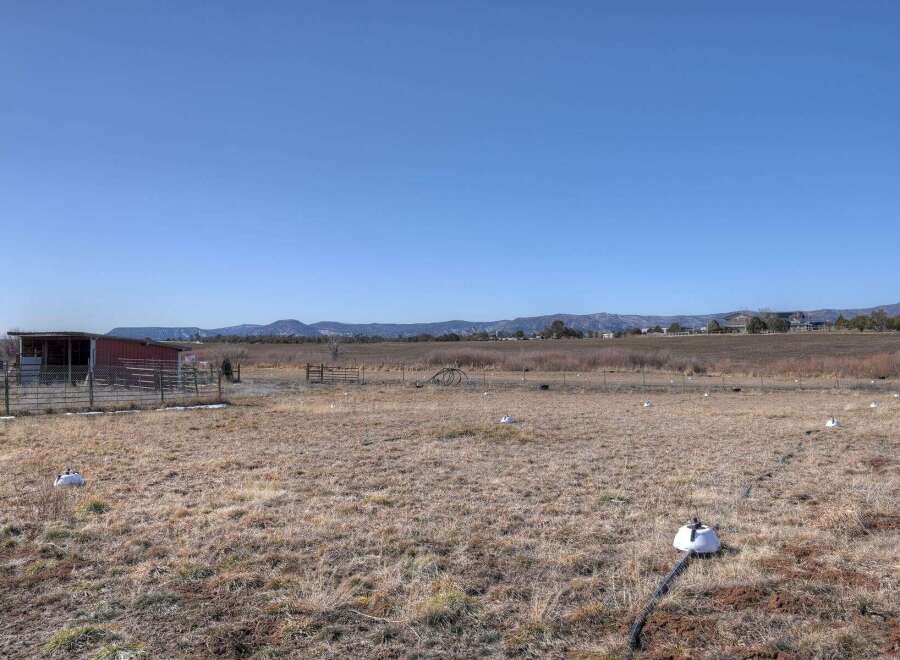 Discover the tranquility of this expansive property, perfect for those seeking a blend of rural charm and modern convenience.