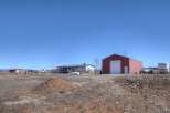 Discover the charm of this spacious property, featuring a well-maintained home and a large red barn, perfect for storage or hobbies.