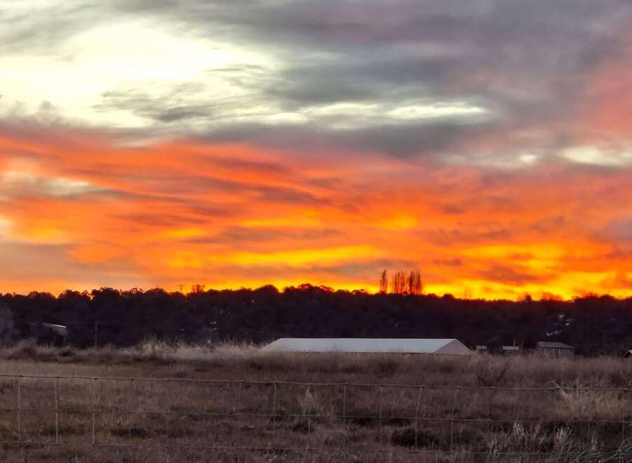 Witness breathtaking sunsets over your future property! This stunning image showcases the vibrant sky, hinting at the peaceful evenings you can enjoy.