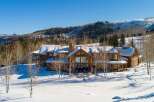 Experience luxury living in this stunning log cabin nestled in a winter wonderland.