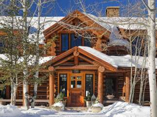 This stunning log cabin home is the perfect mountain retreat, offering a cozy and inviting atmosphere.