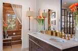 Step into luxury with this stunning bathroom featuring a marble countertop and elegant fixtures.