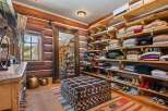 Step into luxury with this stunning walk-in closet, a true haven for organization and style.