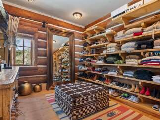 Step into luxury with this stunning walk-in closet, a true haven for organization and style.