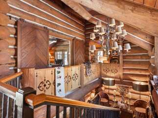 Step into rustic elegance with this stunning log cabin interior.