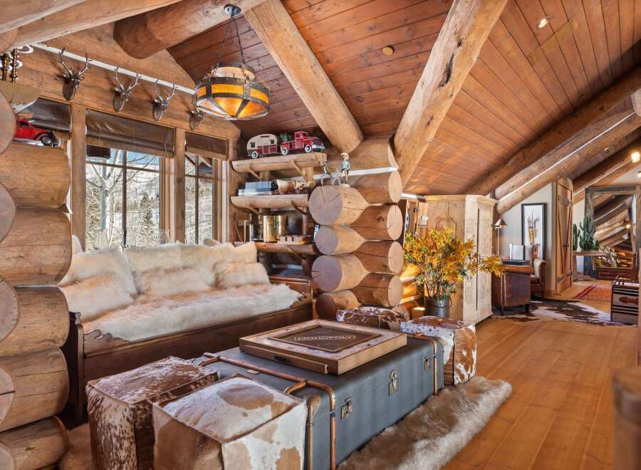 Step into rustic luxury with this stunning log cabin interior.