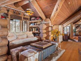 Step into rustic luxury with this stunning log cabin interior.