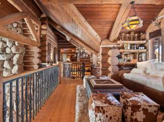 Step into rustic luxury with this stunning log cabin interior.