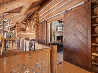 Step into rustic elegance with this stunning log cabin interior.