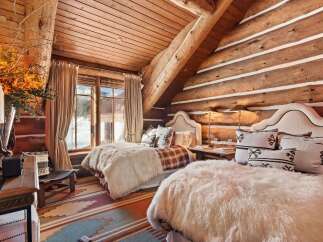 Step into rustic luxury in this stunning bedroom.
