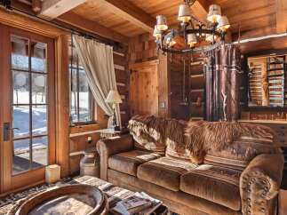 Step into rustic luxury with this stunning log cabin interior.