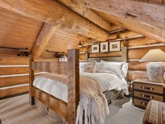 Step into rustic elegance with this stunning bedroom.