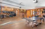 This stunning property boasts a unique garage space, perfect for both recreation and storage.