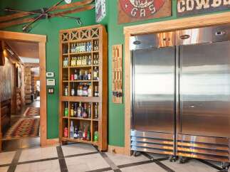 This stunning property boasts a rustic charm with its wooden accents and inviting atmosphere.
