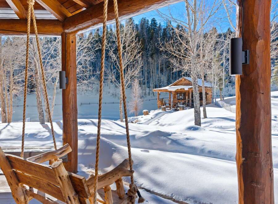 Experience the tranquility of winter in this stunning log cabin retreat.