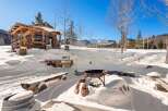 Experience the ultimate winter retreat in this stunning cabin nestled in a snowy landscape.