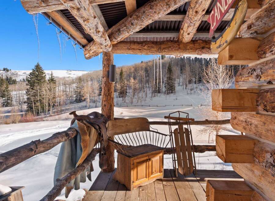 Experience the charm of this rustic cabin, nestled in a winter wonderland.