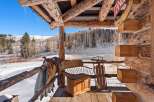 Experience the charm of this rustic cabin, nestled in a winter wonderland.