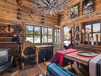 Step into rustic charm with this cozy cabin retreat.