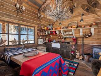 Step into rustic charm with this cozy cabin retreat.