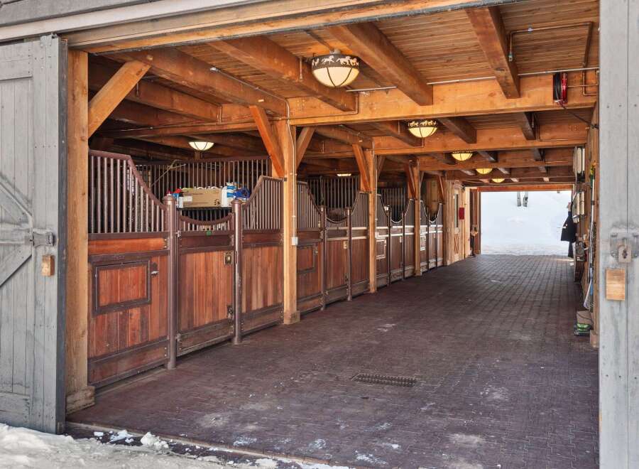 Step into a world of rustic elegance with this stunning horse stable.
