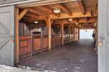 Step into a world of rustic elegance with this stunning horse stable.