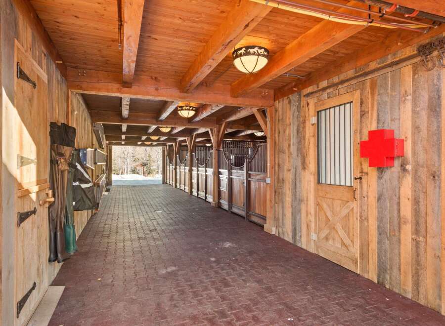 This stunning equestrian property boasts a beautifully designed stable, perfect for horse enthusiasts.